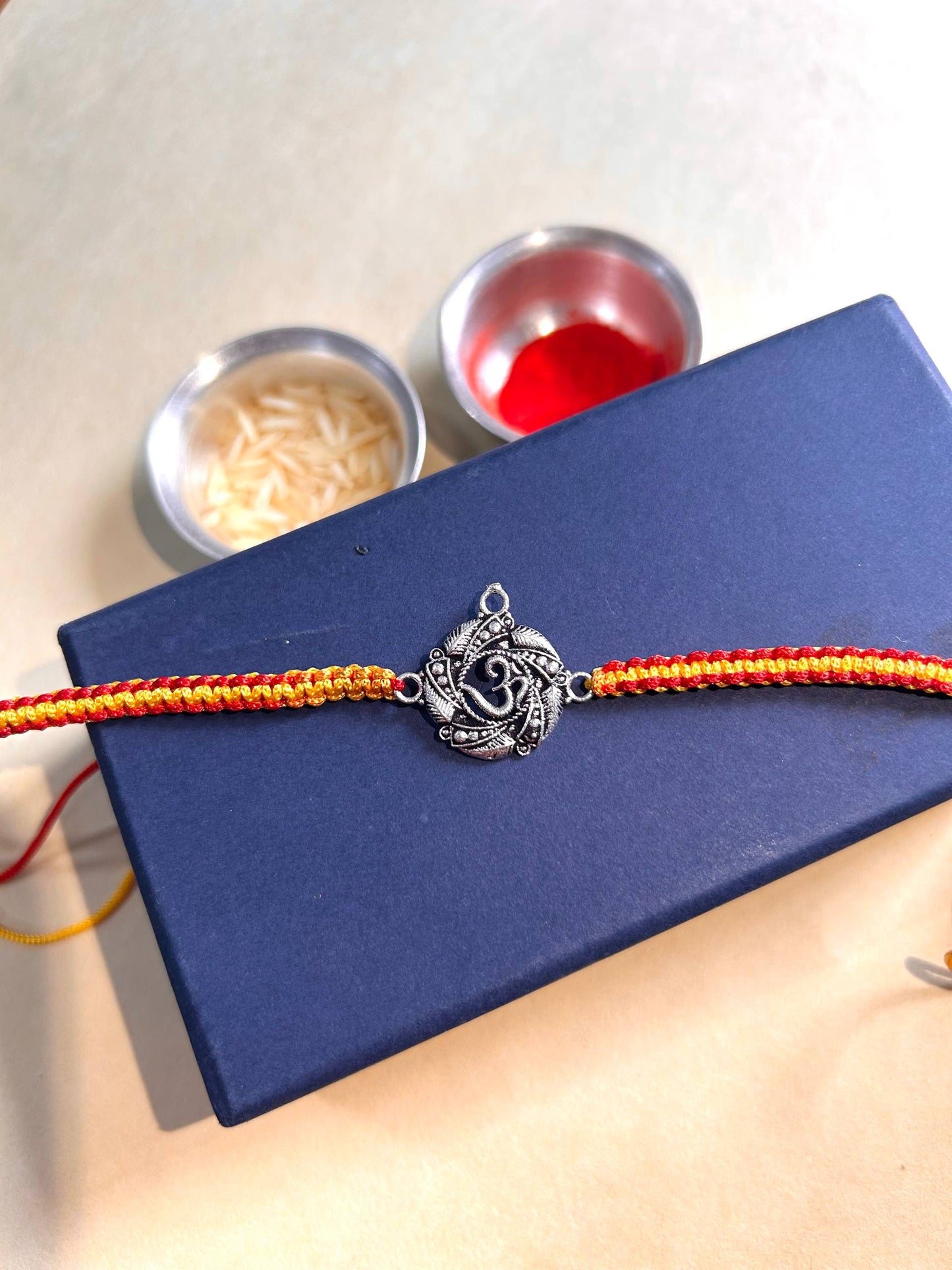 Om Silver Rakhi