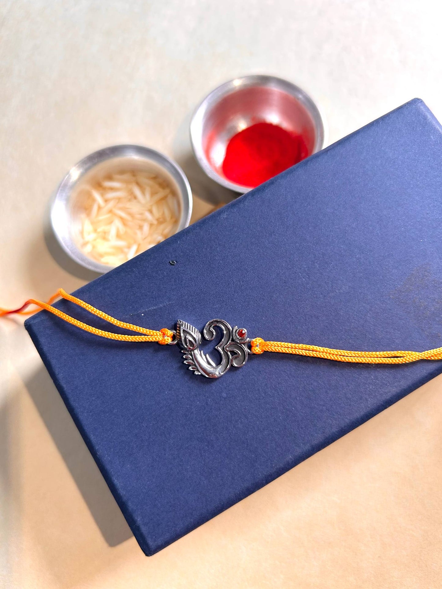Om Morpankh Silver Rakhi